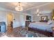 Spacious main bedroom featuring a ceiling fan, an en-suite bathroom, and neutral decor at 12166 N Bray Rd, Mooresville, IN 46158