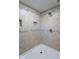 Tiled shower featuring built-in shower niche and bronze fixtures at 12166 N Bray Rd, Mooresville, IN 46158