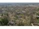 Expansive aerial view of a home nestled among mature trees, showcasing its secluded location and surrounding landscape at 123 W 81St St, Indianapolis, IN 46260