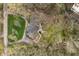 Aerial view of the property featuring a patio, fire pit area, and mature trees on a sprawling lot at 123 W 81St St, Indianapolis, IN 46260