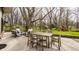 Outdoor patio area with seating, a dining table, and a peaceful backyard setting at 123 W 81St St, Indianapolis, IN 46260