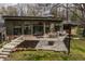 A patio space featuring outdoor seating, a dining area, and a fire pit for outdoor relaxation at 123 W 81St St, Indianapolis, IN 46260