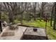 Outdoor patio featuring a lounge area, dining set, fire pit, and treehouse at 123 W 81St St, Indianapolis, IN 46260