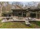 Backyard patio with a lounge area, dining set, and fire pit, perfect for entertaining at 123 W 81St St, Indianapolis, IN 46260