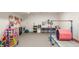 Spacious finished basement area set up as a playroom with fun and engaging activities for children at 123 W 81St St, Indianapolis, IN 46260