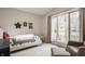 Comfortable bedroom with a cozy chair and large window offering natural light and outdoor views at 123 W 81St St, Indianapolis, IN 46260