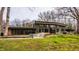 Beautiful home exterior with large windows overlooking the backyard and patio at 123 W 81St St, Indianapolis, IN 46260