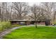 Beautiful front lawn and brick and modern style home with inviting curb appeal at 123 W 81St St, Indianapolis, IN 46260