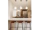 Eat-in kitchen features modern appliances, a breakfast bar with pendant lighting, and plenty of storage at 123 W 81St St, Indianapolis, IN 46260