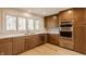 Modern kitchen features stainless steel appliances, and custom wood cabinetry at 123 W 81St St, Indianapolis, IN 46260