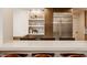 Eat-in kitchen features modern appliances, a breakfast bar with pendant lighting, and plenty of storage at 123 W 81St St, Indianapolis, IN 46260