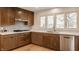 Stylish kitchen with stainless steel appliances, quartz countertops, and wood cabinets at 123 W 81St St, Indianapolis, IN 46260