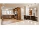 Spacious kitchen with stainless steel appliances, wood cabinetry, and breakfast bar seating at 123 W 81St St, Indianapolis, IN 46260