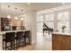 Open-concept living area with grand piano, fireplace, and lots of natural light at 123 W 81St St, Indianapolis, IN 46260