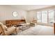 Comfortable living room features stylish wallpaper and leather furniture at 123 W 81St St, Indianapolis, IN 46260
