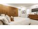 Serene main bedroom featuring a large bed, sleek wood wardrobe, and access to an ensuite bathroom at 123 W 81St St, Indianapolis, IN 46260