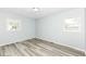 Bright bedroom with gray walls, plank flooring and two windows for natural light at 1254 E 400 N, Greenfield, IN 46140