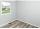Small room with gray walls, gray floors, and large window at 1254 E 400 N, Greenfield, IN 46140