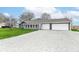 Charming home featuring a gravel driveway and attached two-car garage, perfect for suburban living at 1254 E 400 N, Greenfield, IN 46140