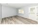 Inviting living room with modern gray vinyl floors, bright natural light, and fresh paint at 1254 E 400 N, Greenfield, IN 46140