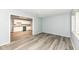 Spacious living room featuring modern floors and an open transition to the kitchen area at 1254 E 400 N, Greenfield, IN 46140