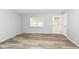 Light-filled living room with modern floors and a large window at 1254 E 400 N, Greenfield, IN 46140