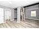 Open living space with a ladder and views of bathroom and backyard at 1254 E 400 N, Greenfield, IN 46140