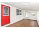 Inviting sunroom with a red exterior door, featuring natural light and cozy atmosphere at 1254 E 400 N, Greenfield, IN 46140