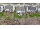 Aerial view of the home with a spacious backyard, patio set, grill, and green lawn surrounded by a fence at 12753 Bristow Ln, Fishers, IN 46037