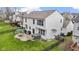 Large backyard includes a patio, grill, hot tub, and a lush lawn, enclosed by a fence for privacy at 12753 Bristow Ln, Fishers, IN 46037