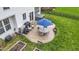Aerial view of backyard features a patio, hot tub, manicured lawn, and outdoor dining set at 12753 Bristow Ln, Fishers, IN 46037