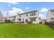 Expansive backyard featuring a well-maintained lawn, patio with seating, and a relaxing hot tub at 12753 Bristow Ln, Fishers, IN 46037