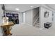 Finished basement with neutral carpet, work space and stairs leading to main level at 12753 Bristow Ln, Fishers, IN 46037