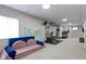 Finished basement with seating, gym, and carpeted floor at 12753 Bristow Ln, Fishers, IN 46037