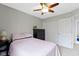 Bright bedroom features a ceiling fan, closet space, and access to an adjoining room at 12753 Bristow Ln, Fishers, IN 46037