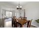Open dining area with backyard views complements the adjacent living room, enhancing entertaining at 12753 Bristow Ln, Fishers, IN 46037