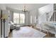Inviting living space with an armchair and a decorative rug near the home's entrance and staircase at 12753 Bristow Ln, Fishers, IN 46037