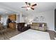 Open living room with fireplace, couches, and access to the kitchen at 12753 Bristow Ln, Fishers, IN 46037