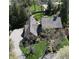 Aerial view showcases the home's roof, driveway, and landscaped grounds at 13599 Brentwood Ln, Carmel, IN 46033