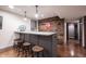 Finished basement bar area features a rustic wooden accent wall with a Coca-Cola sign at 13599 Brentwood Ln, Carmel, IN 46033