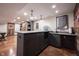 Finished basement bar area with a microwave and sink for your refreshment needs at 13599 Brentwood Ln, Carmel, IN 46033