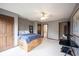 View of second bedroom with ensuite bathroom. Has a ceiling fan, storage bed, and is freshly painted at 13599 Brentwood Ln, Carmel, IN 46033