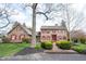 Charming home featuring red shutters and a brick walkway at 13599 Brentwood Ln, Carmel, IN 46033