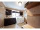 Functional laundry room with washer, dryer, sink and storage cabinets at 13599 Brentwood Ln, Carmel, IN 46033