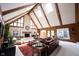 Bright living room with vaulted ceiling, skylights, stone fireplace, and comfortable seating at 13599 Brentwood Ln, Carmel, IN 46033