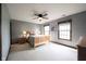 This is a comfortable primary bedroom with carpet and natural light streaming in from the two large windows at 13599 Brentwood Ln, Carmel, IN 46033