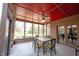 Inviting screened porch includes ceiling fan and a table for outdoor dining at 13599 Brentwood Ln, Carmel, IN 46033