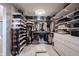 Organized walk-in closet with ample shelving, hanging space, and storage solutions at 13599 Brentwood Ln, Carmel, IN 46033