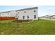 Backyard featuring grass, a small patio area with wooden border and a fence at 13820 N Cardonia Dr, Camby, IN 46113