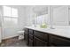 Bright bathroom with a double vanity, and a shower-tub combo at 13820 N Cardonia Dr, Camby, IN 46113